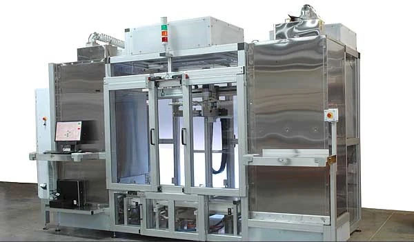 A dip molding machine that is sitting in a room