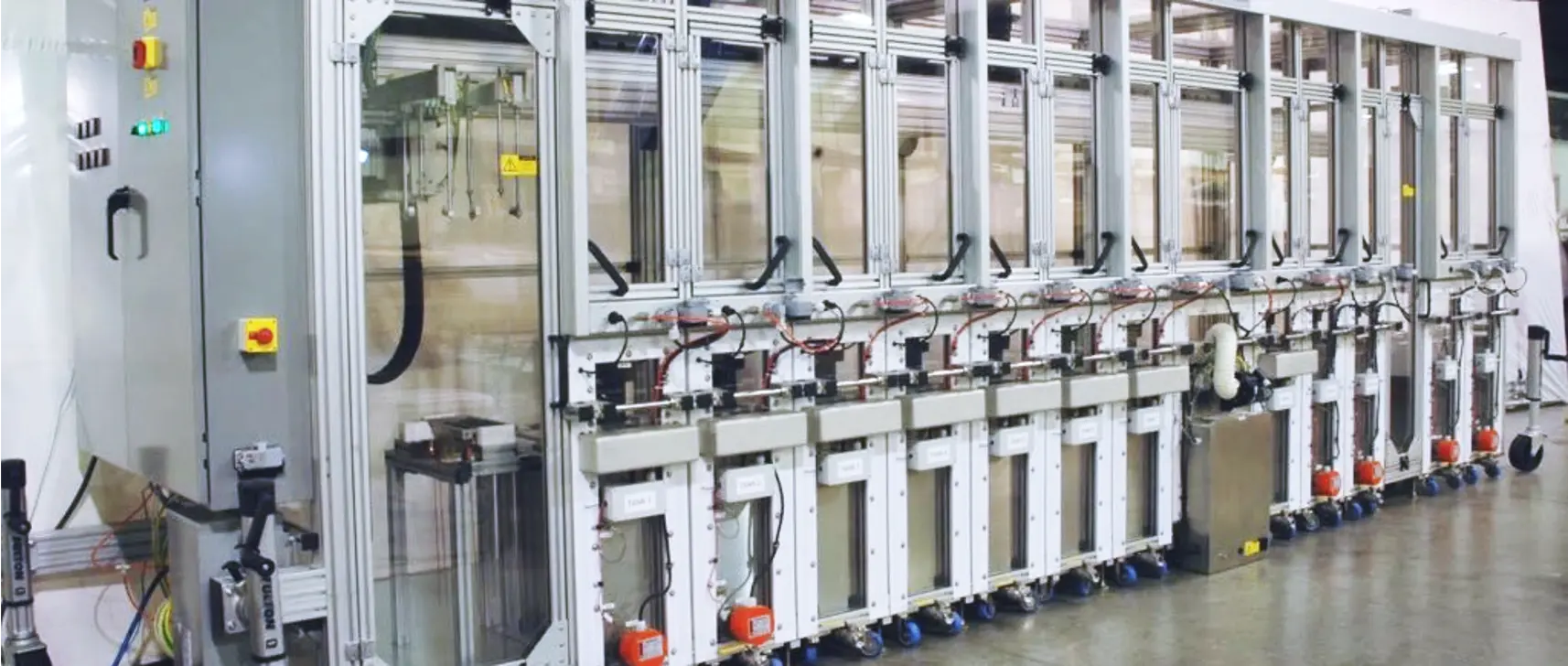 A row of machines sitting inside of a building